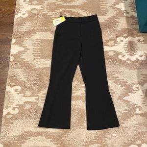 Black formal pants. Polyester. Slightly flared.